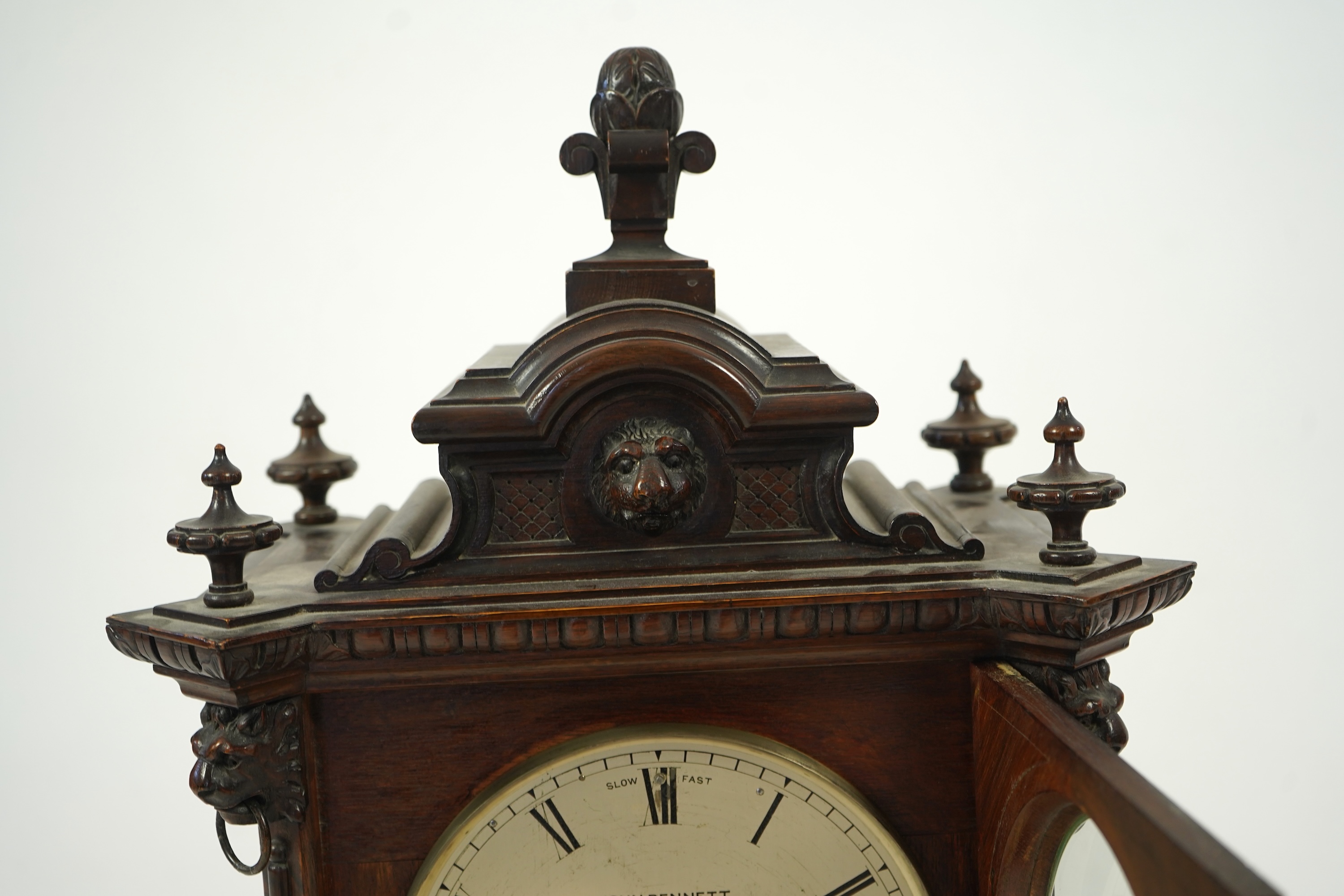 A late 19th century carved oak triple fusee bracket clock
